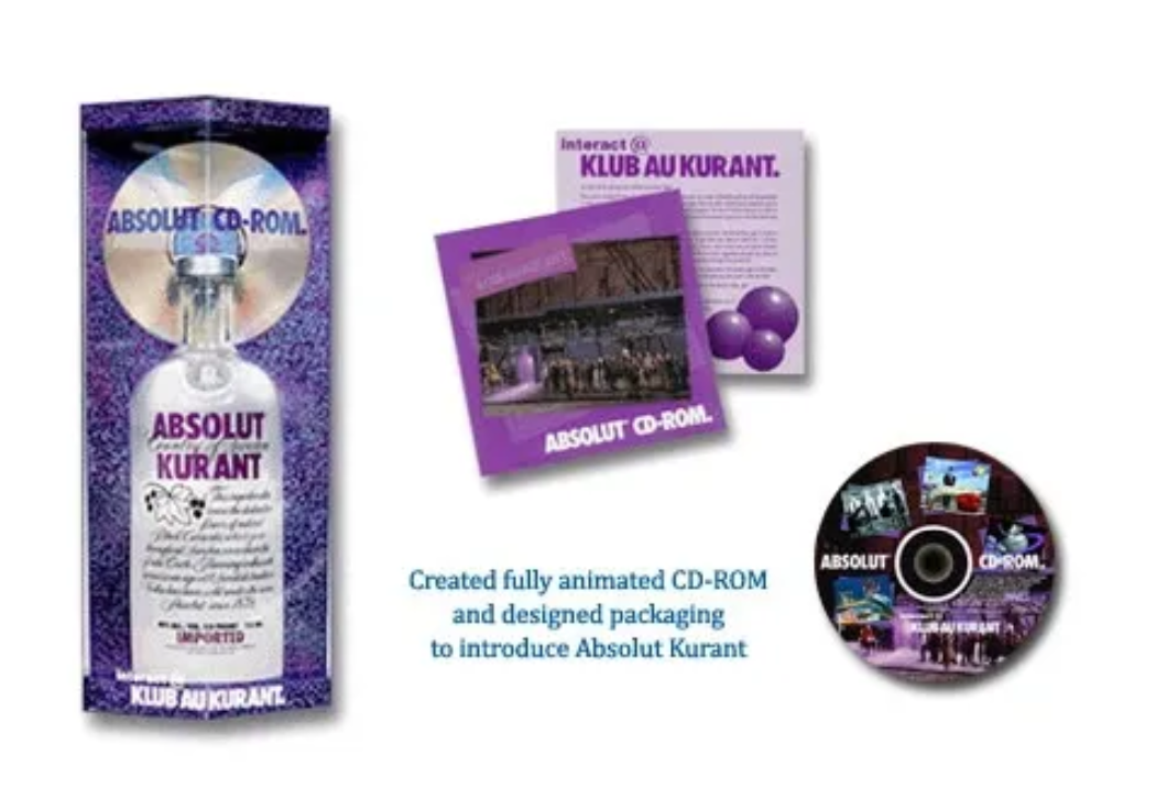 Absolut Kurant packaging and the Klub Au Kurant CD-ROM, shown with promotional inserts